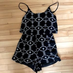 Black romper with white accents size small